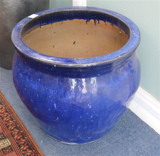 A blue glazed pottery garden urn, Diameter 54cm